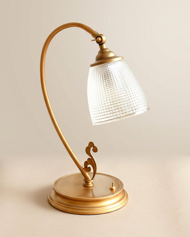 Lampa stołowa vintage z zakrzywionym designem i metalicznym wykończeniem w kolorze złota, ideal 1